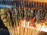 Lamb kebabs are seen at a stall at a night market in Guiyang, China, on August 25, 2024. (