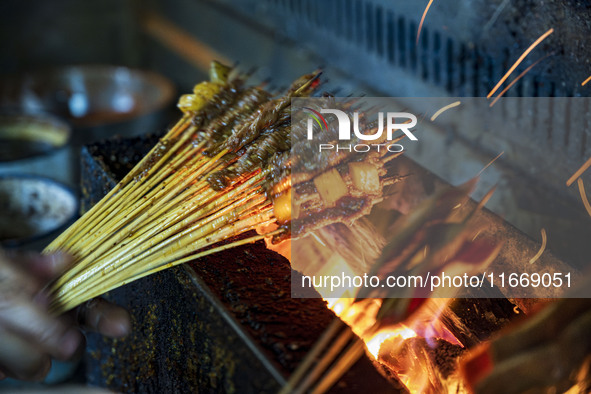 Lamb kebabs are seen at a stall at a night market in Guiyang, China, on August 25, 2024. 