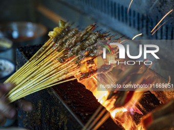 Lamb kebabs are seen at a stall at a night market in Guiyang, China, on August 25, 2024. (