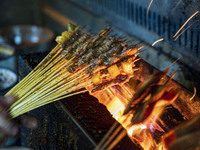 Lamb kebabs are seen at a stall at a night market in Guiyang, China, on August 25, 2024. (