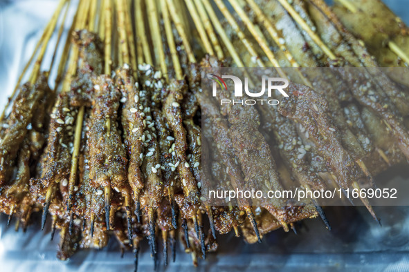 Lamb kebabs are seen at a stall at a night market in Guiyang, China, on August 25, 2024. 