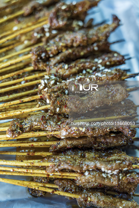 Lamb kebabs are seen at a stall at a night market in Guiyang, China, on August 25, 2024. 