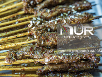 Lamb kebabs are seen at a stall at a night market in Guiyang, China, on August 25, 2024. (