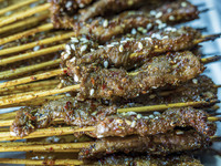 Lamb kebabs are seen at a stall at a night market in Guiyang, China, on August 25, 2024. (