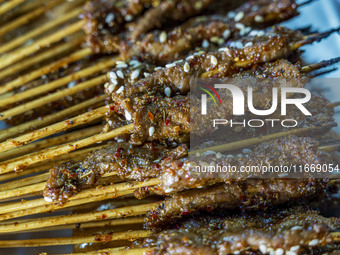 Lamb kebabs are seen at a stall at a night market in Guiyang, China, on August 25, 2024. (