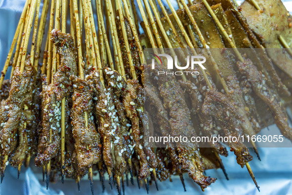 Lamb kebabs are seen at a stall at a night market in Guiyang, China, on August 25, 2024. 