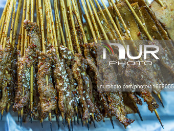 Lamb kebabs are seen at a stall at a night market in Guiyang, China, on August 25, 2024. (