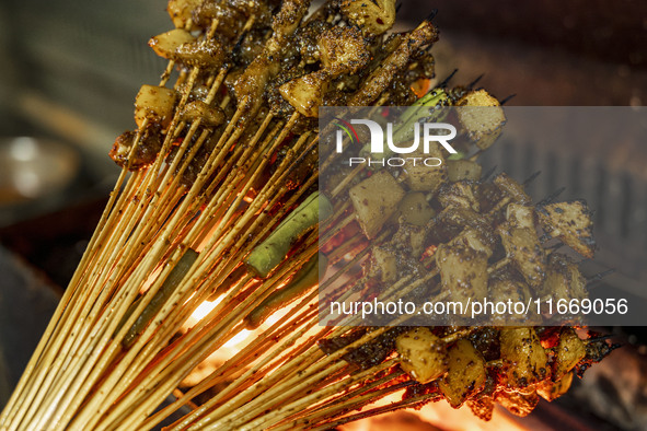 Lamb kebabs are seen at a stall at a night market in Guiyang, China, on August 25, 2024. 