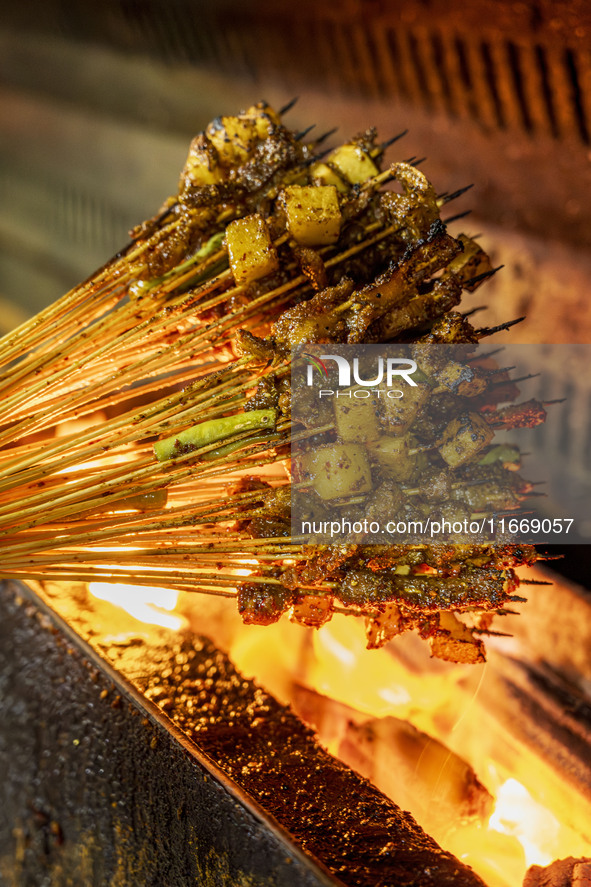 Lamb kebabs are seen at a stall at a night market in Guiyang, China, on August 25, 2024. 