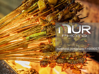 Lamb kebabs are seen at a stall at a night market in Guiyang, China, on August 25, 2024. (