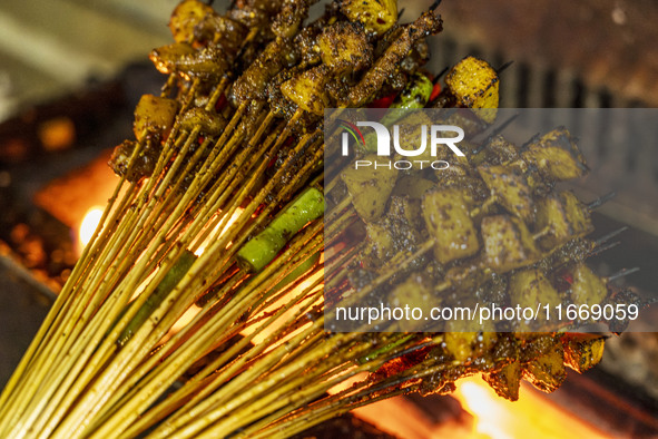 Lamb kebabs are seen at a stall at a night market in Guiyang, China, on August 25, 2024. 