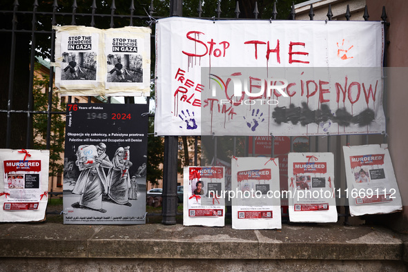 Pro-Palestinian banners are hanging on a fence during occupational strike in the yard of Jagiellonian University in Krakow, Poland on Octobe...