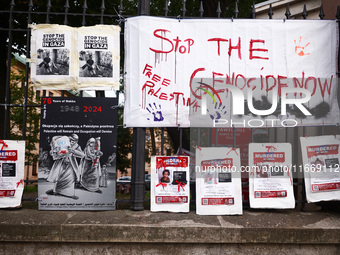 Pro-Palestinian banners are hanging on a fence during occupational strike in the yard of Jagiellonian University in Krakow, Poland on Octobe...