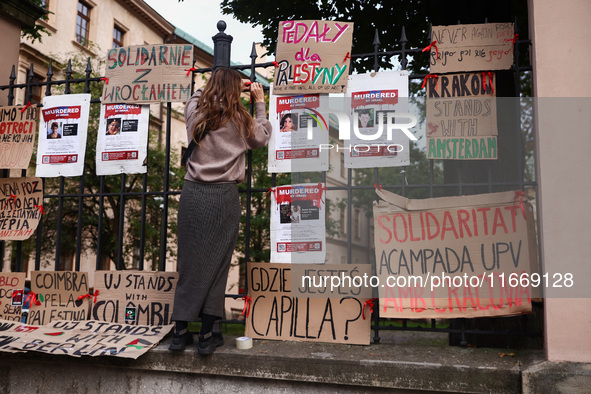 Pro-Palestinian banners are hanging on a fence during occupational strike in the yard of Jagiellonian University in Krakow, Poland on Octobe...