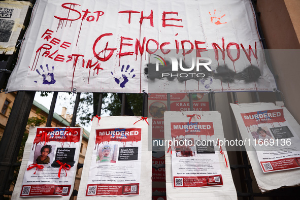 Pro-Palestinian banners are hanging on a fence during occupational strike in the yard of Jagiellonian University in Krakow, Poland on Octobe...