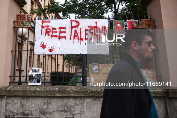 Pro-Palestinian banners are hanging on a fence during occupational strike in the yard of Jagiellonian University in Krakow, Poland on Octobe...