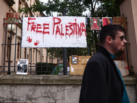 Pro-Palestinian banners are hanging on a fence during occupational strike in the yard of Jagiellonian University in Krakow, Poland on Octobe...