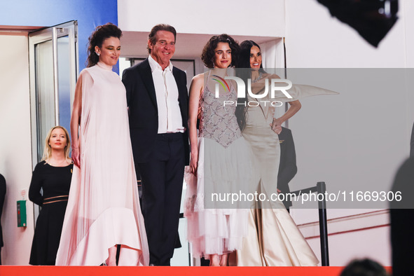 Dennis Quaid, Coralie Fargeat, Margaret Qualley, and Demi Moore attend the red carpet for the premiere of The Substance during the 77th Fest...