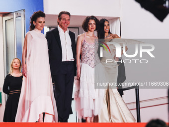 Dennis Quaid, Coralie Fargeat, Margaret Qualley, and Demi Moore attend the red carpet for the premiere of The Substance during the 77th Fest...