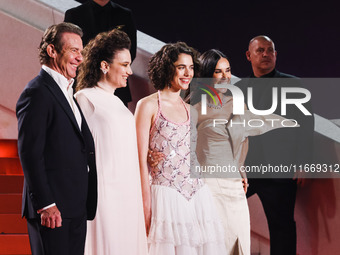 Dennis Quaid, Coralie Fargeat, Margaret Qualley, and Demi Moore attend the red carpet for the premiere of The Substance during the 77th Fest...