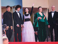 Sean Baker, Mikey Madison, and Mark Eydelshteyn attend the red carpet for the premiere of Anora during the 77th Festival de Cannes in Cannes...