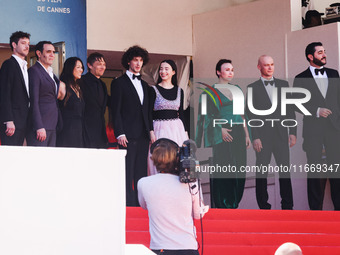 Sean Baker, Mikey Madison, and Mark Eydelshteyn attend the red carpet for the premiere of Anora during the 77th Festival de Cannes in Cannes...