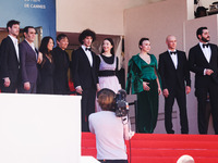 Sean Baker, Mikey Madison, and Mark Eydelshteyn attend the red carpet for the premiere of Anora during the 77th Festival de Cannes in Cannes...