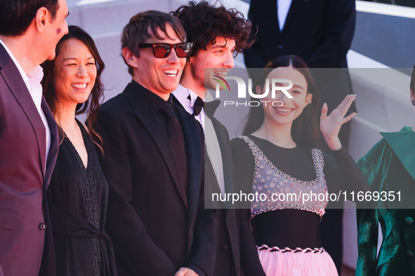 Sean Baker, Mikey Madison, and Mark Eydelshteyn attend the red carpet for the premiere of Anora during the 77th Festival de Cannes in Cannes...