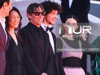 Sean Baker, Mikey Madison, and Mark Eydelshteyn attend the red carpet for the premiere of Anora during the 77th Festival de Cannes in Cannes...