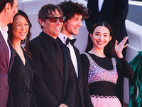 Sean Baker, Mikey Madison, and Mark Eydelshteyn attend the red carpet for the premiere of Anora during the 77th Festival de Cannes in Cannes...