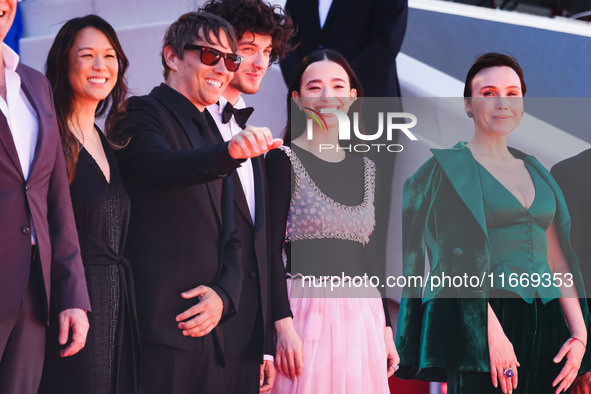 Sean Baker and Mikey Madison attend the red carpet for the premiere of Anora during the 77th Festival de Cannes in Cannes, France, on May 21...