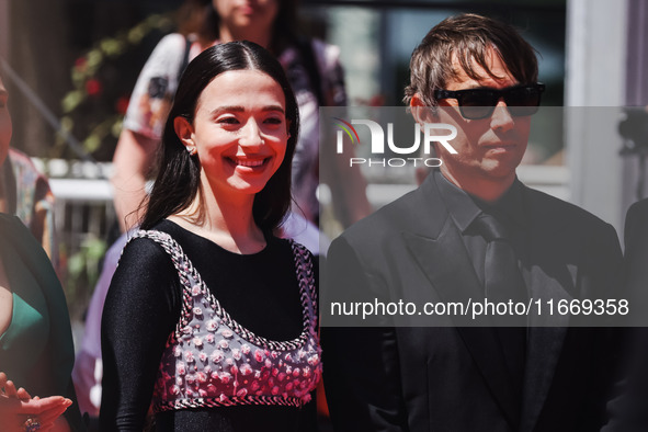 Sean Baker and Mikey Madison attend the red carpet for the premiere of Anora during the 77th Festival de Cannes in Cannes, France, on May 21...