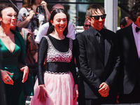 Sean Baker and Mikey Madison attend the red carpet for the premiere of Anora during the 77th Festival de Cannes in Cannes, France, on May 21...