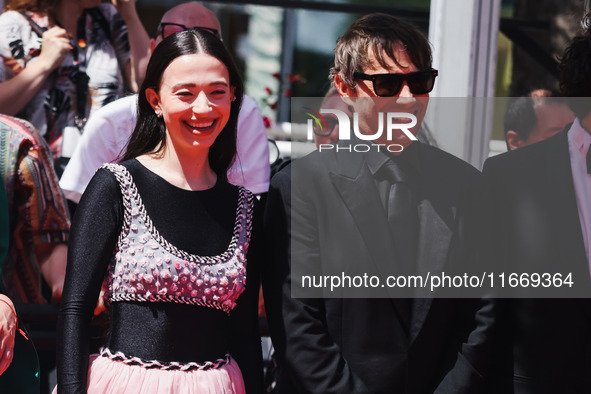 Sean Baker and Mikey Madison attend the red carpet for the premiere of Anora during the 77th Festival de Cannes in Cannes, France, on May 21...