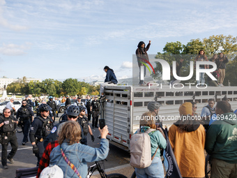 Indigenous demonstrators stand atop a horse trailer near the U.S. Capitol in Washington, D.C. on October 15, 2024 after U.S. Park Police att...