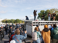 Indigenous demonstrators stand atop a horse trailer near the U.S. Capitol in Washington, D.C. on October 15, 2024 after U.S. Park Police att...