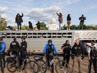 Police surround a horse trailer after Indigenous demonstrators clash with police near the U.S. Capitol in Washington, D.C. on October 15, 20...