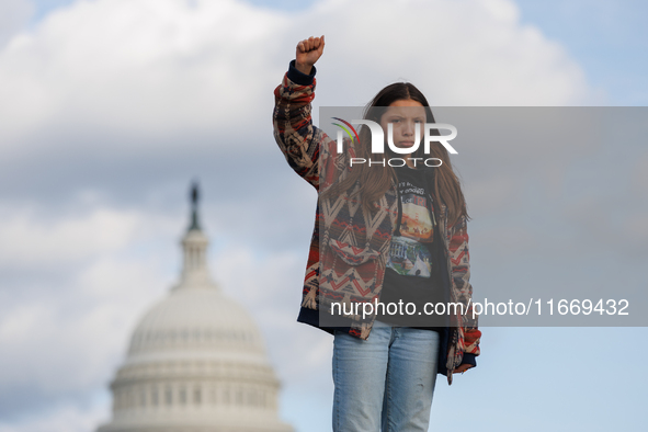 An Indigenous demonstrator stands atop a horse trailer near the U.S. Capitol in Washington, D.C. on October 15, 2024 after U.S. Park Police...