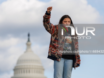 An Indigenous demonstrator stands atop a horse trailer near the U.S. Capitol in Washington, D.C. on October 15, 2024 after U.S. Park Police...