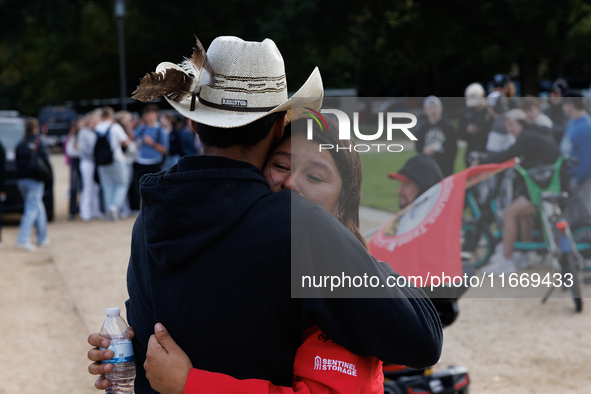 A woman is comforted by someone after Indigenous demonstrators clash with police near the U.S. Capitol in Washington, D.C. on October 15, 20...