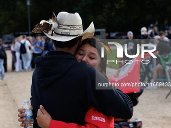 A woman is comforted by someone after Indigenous demonstrators clash with police near the U.S. Capitol in Washington, D.C. on October 15, 20...