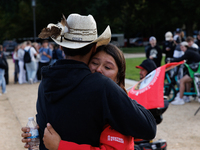 A woman is comforted by someone after Indigenous demonstrators clash with police near the U.S. Capitol in Washington, D.C. on October 15, 20...