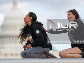 Indigenous demonstrators sit atop a horse trailer near the U.S. Capitol in Washington, D.C. on October 15, 2024 after clashing with U.S. Par...