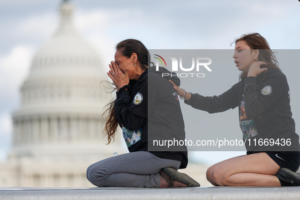 Indigenous demonstrators sit atop a horse trailer near the U.S. Capitol in Washington, D.C. on October 15, 2024 after clashing with U.S. Par...