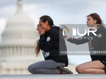 Indigenous demonstrators sit atop a horse trailer near the U.S. Capitol in Washington, D.C. on October 15, 2024 after clashing with U.S. Par...