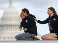 Indigenous demonstrators sit atop a horse trailer near the U.S. Capitol in Washington, D.C. on October 15, 2024 after clashing with U.S. Par...