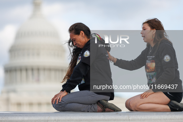 Indigenous demonstrators sit atop a horse trailer near the U.S. Capitol in Washington, D.C. on October 15, 2024 after clashing with U.S. Par...