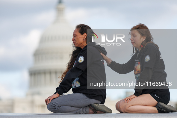 Indigenous demonstrators sit atop a horse trailer near the U.S. Capitol in Washington, D.C. on October 15, 2024 after clashing with U.S. Par...