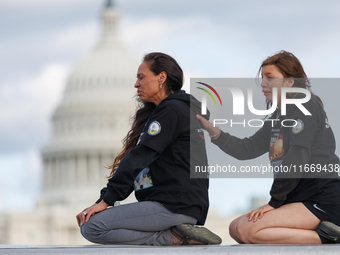 Indigenous demonstrators sit atop a horse trailer near the U.S. Capitol in Washington, D.C. on October 15, 2024 after clashing with U.S. Par...