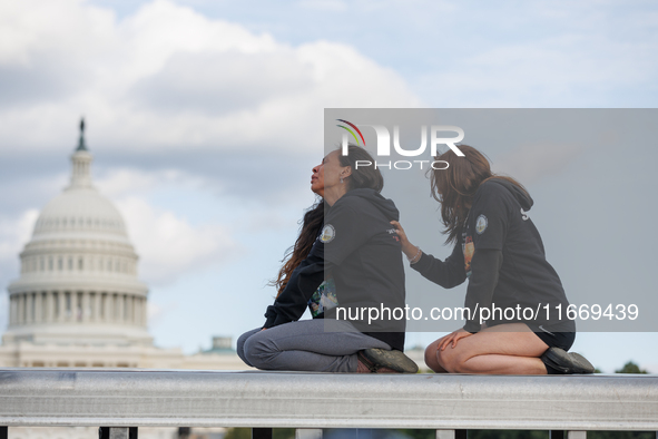 Indigenous demonstrators sit atop a horse trailer near the U.S. Capitol in Washington, D.C. on October 15, 2024 after clashing with U.S. Par...